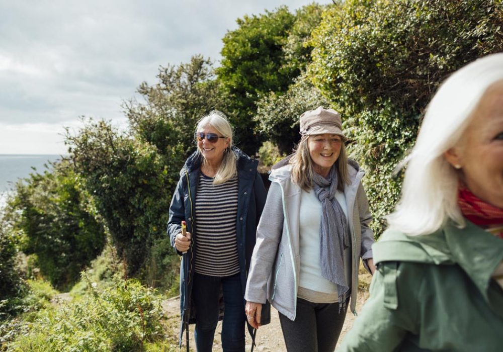 Three ladies walking in countryside