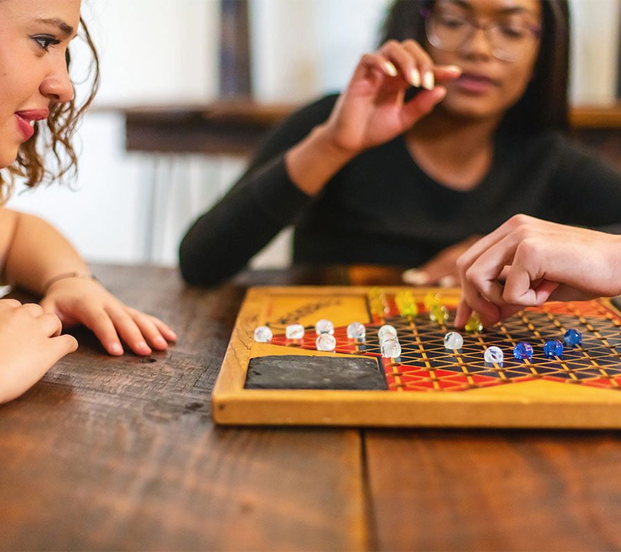 Two girls playing board games