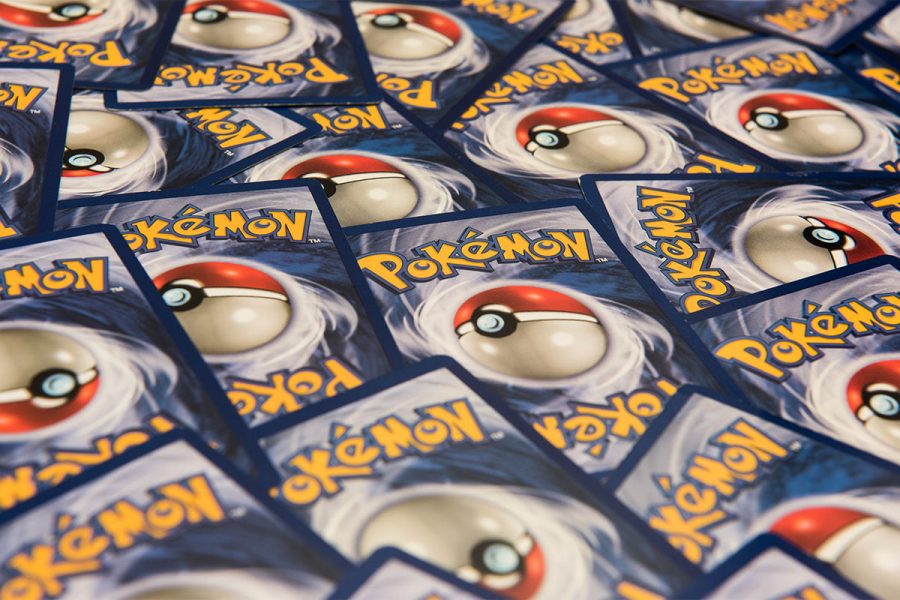 Close up of Pokemon trading cards spread out on a table