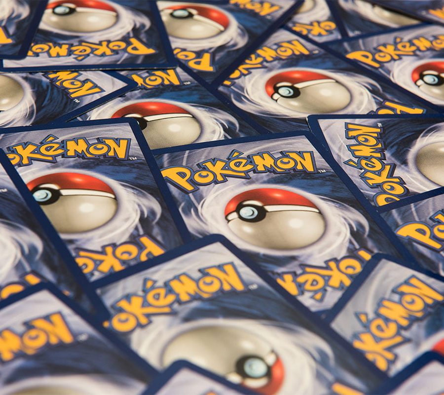 Close up of Pokemon trading cards spread out on a table