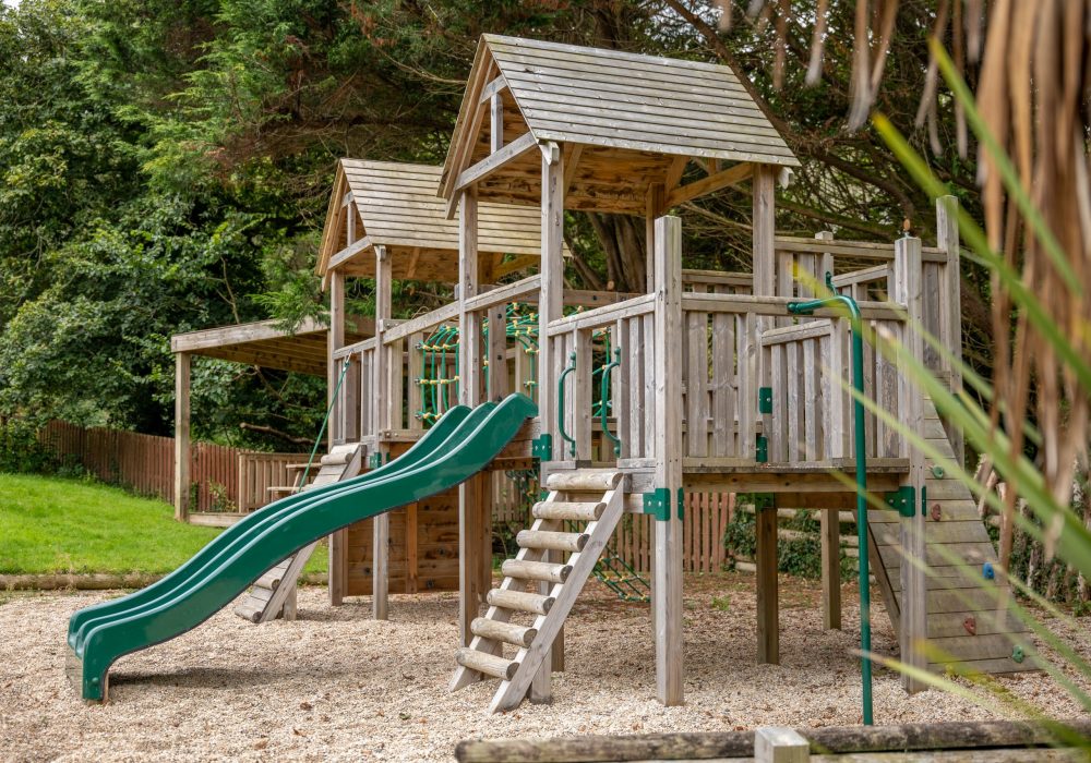 childrens outdoor play area with slide the valley cottages cornwall family resort