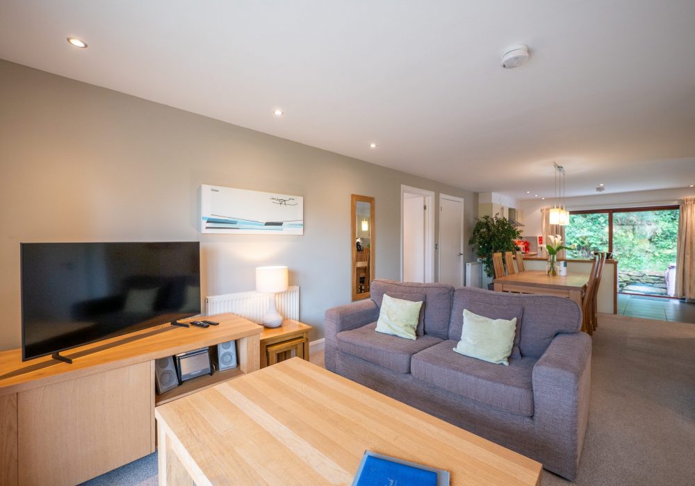 croft cottage the valley cornwall open plan living room dining space and patio