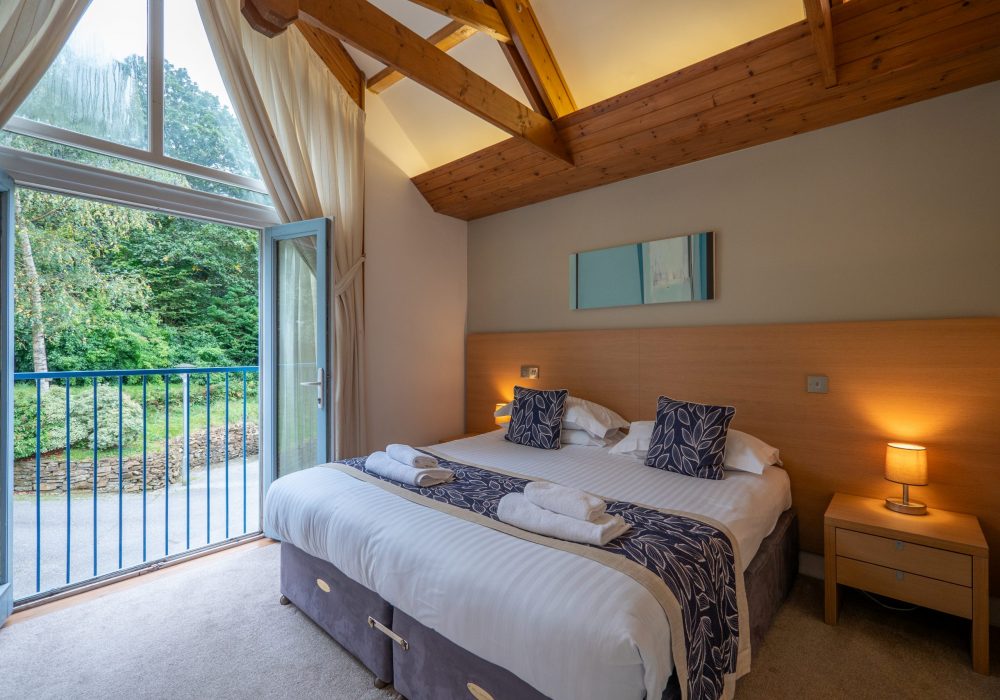 haven cottage master bedroom balcony window woodland forest view the valley cornwall
