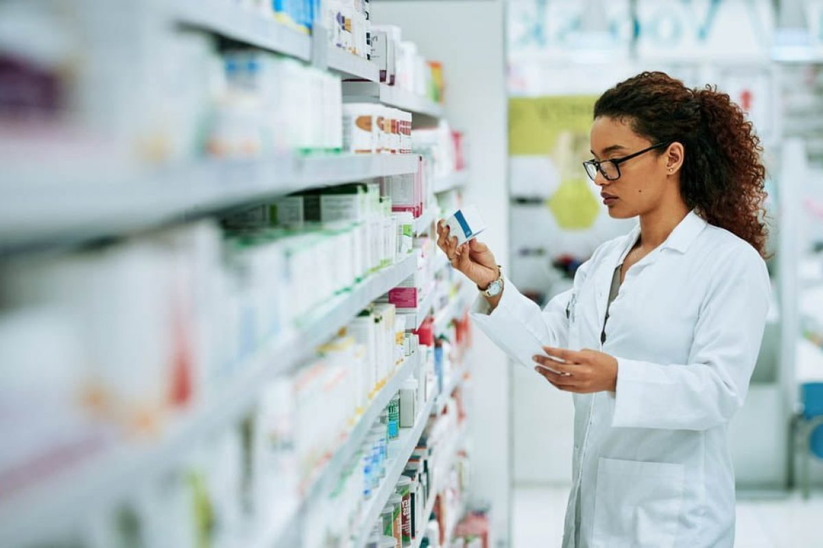 Shot of a young woman filling a prescription while working in a chemist