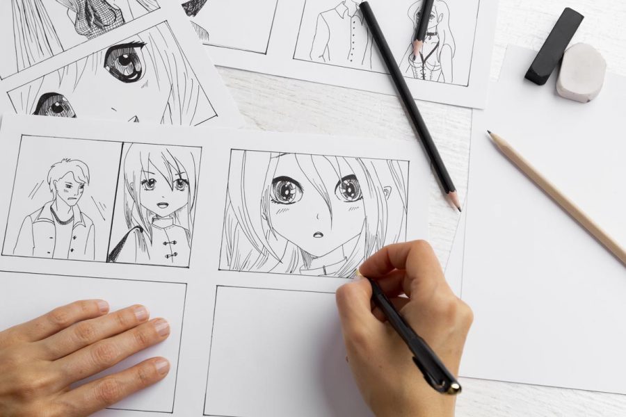 The artist draws anime comics on paper. Storyboard for the cartoon. The illustrator creates sketches for the book. Manga style.