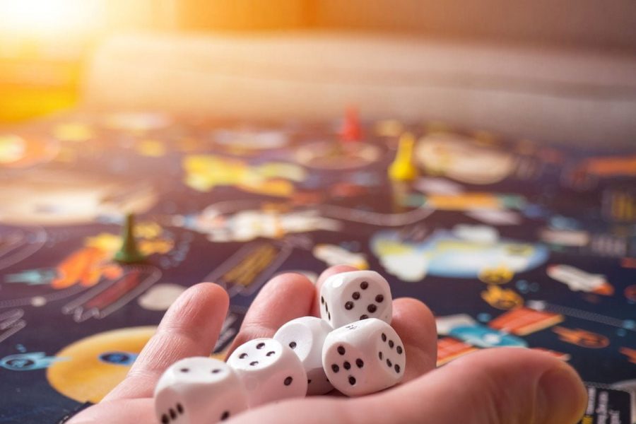 board games concept. Dice, chips and cards on the background of the playing field copy space