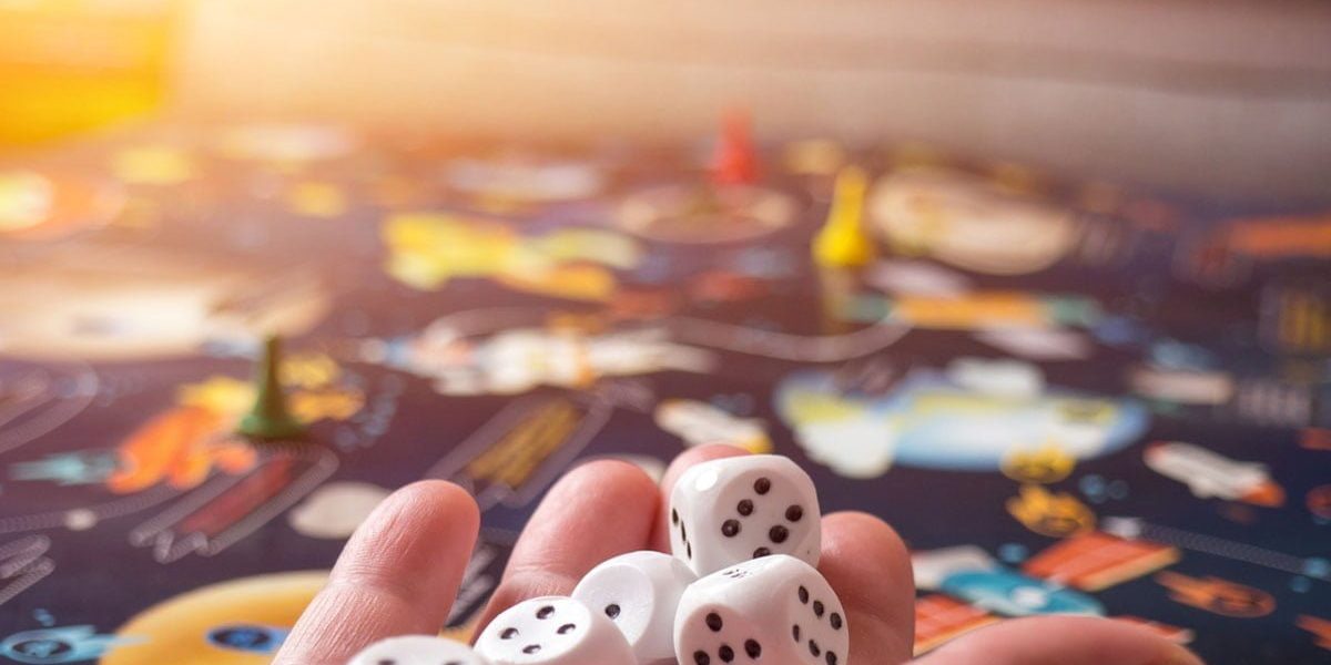 board games concept. Dice, chips and cards on the background of the playing field copy space