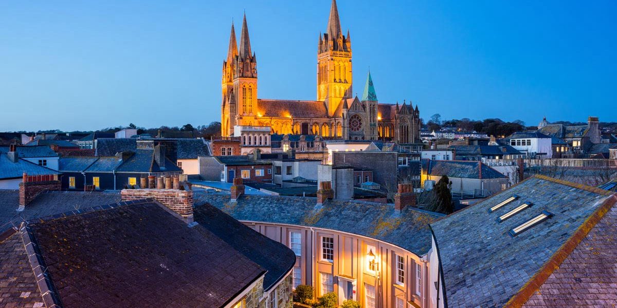 Rooftop view of Truro Cornwall England with the Cathedral illuminated at dusk