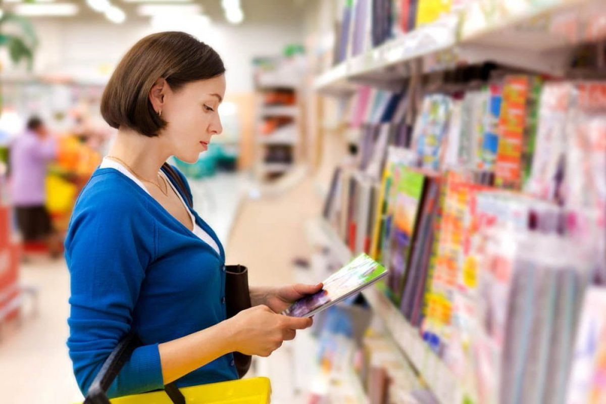 woman buys a magazine