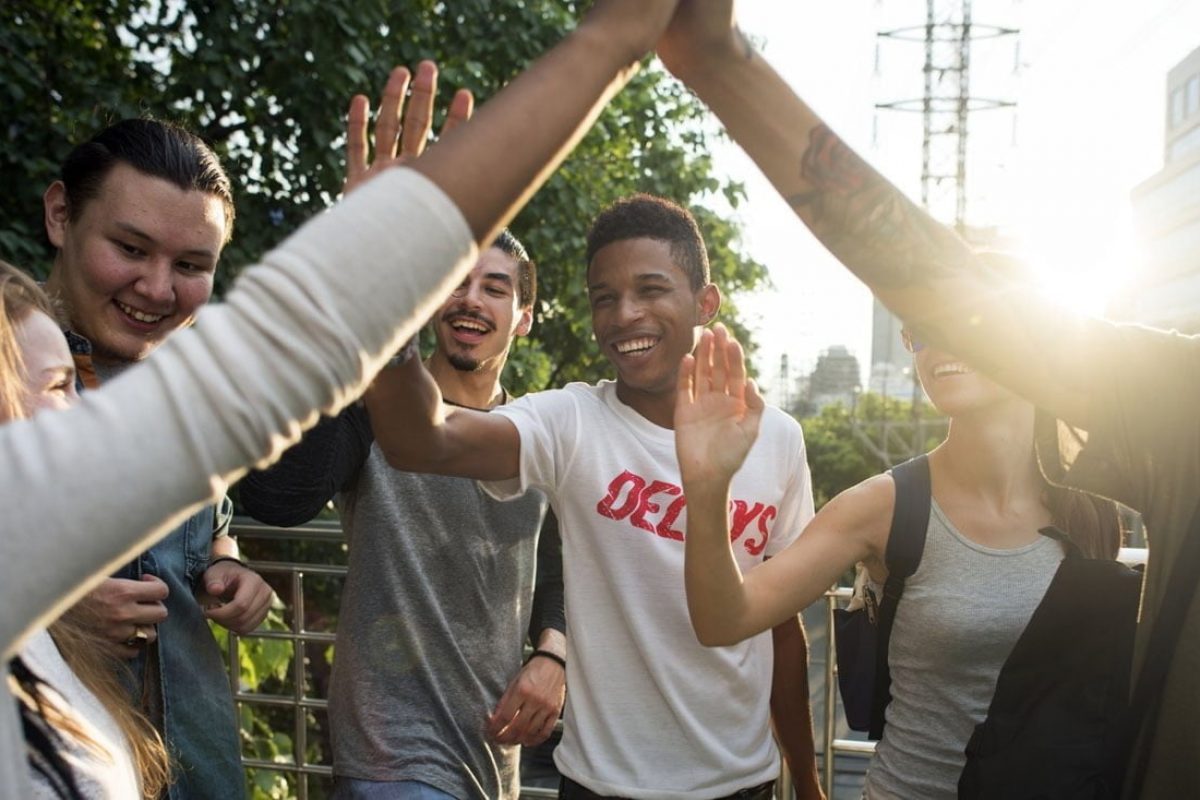 Friends giving high fives