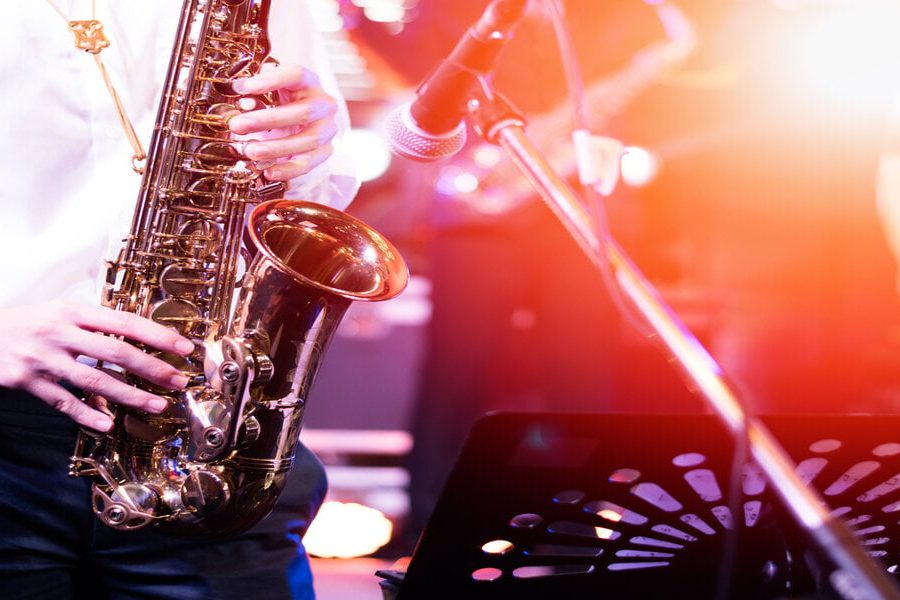 International jazz day and World Jazz festival. Saxophone, music instrument played by saxophonist player musician in fest.