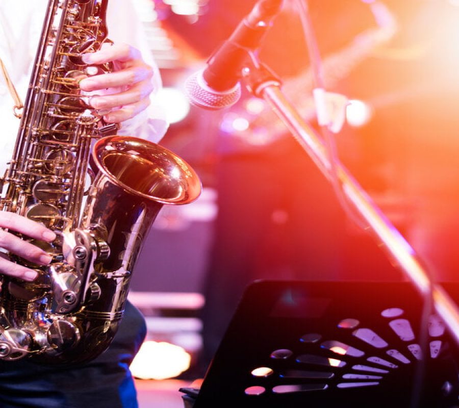 International jazz day and World Jazz festival. Saxophone, music instrument played by saxophonist player musician in fest.