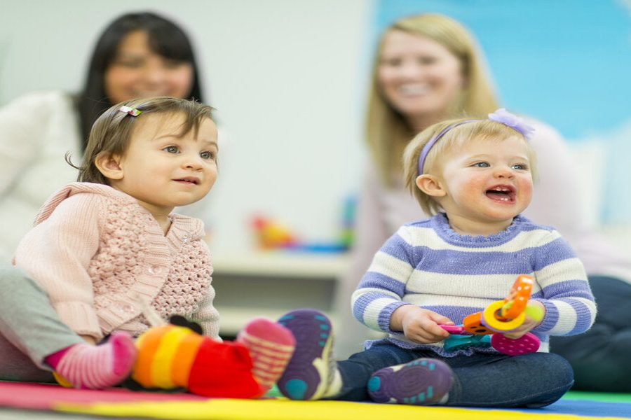 Diverse group of babies playing.