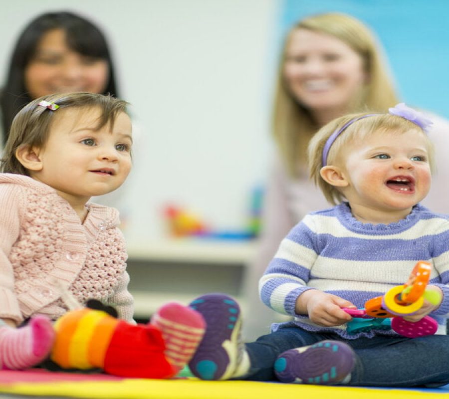 Diverse group of babies playing.