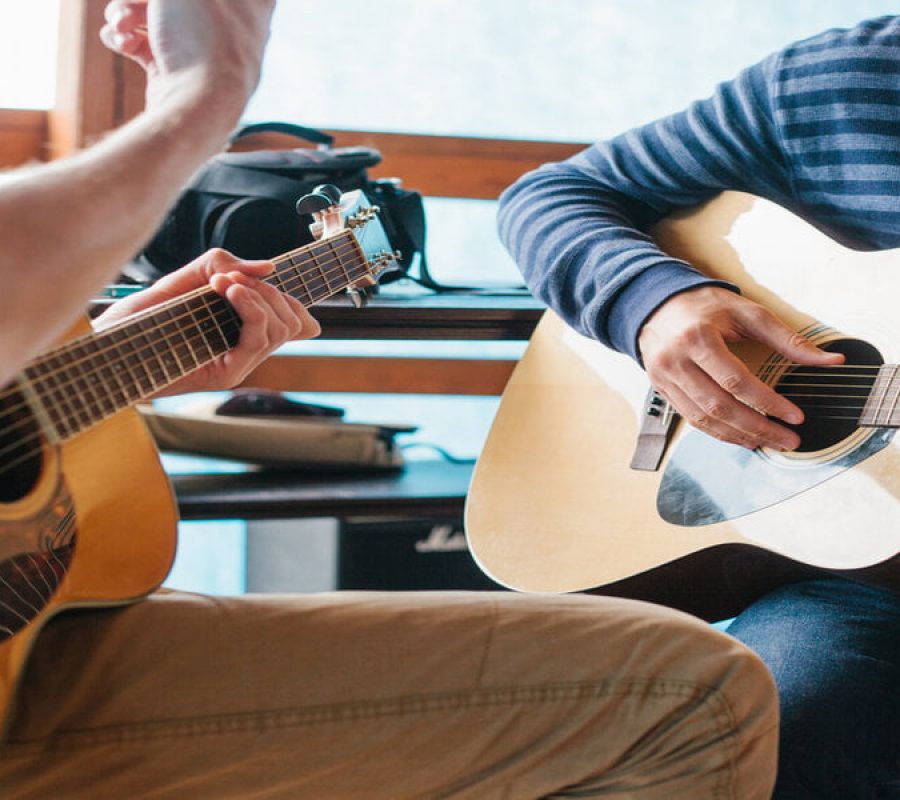Learning to play the guitar. Music education and extra-curricular lessons.